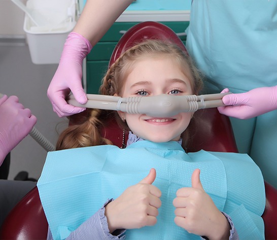 Child receiving nitrous oxide sedation dentistry