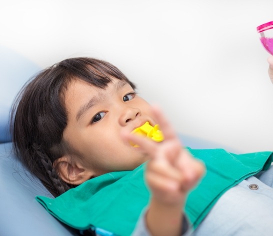 Child receiving fluoride treatment