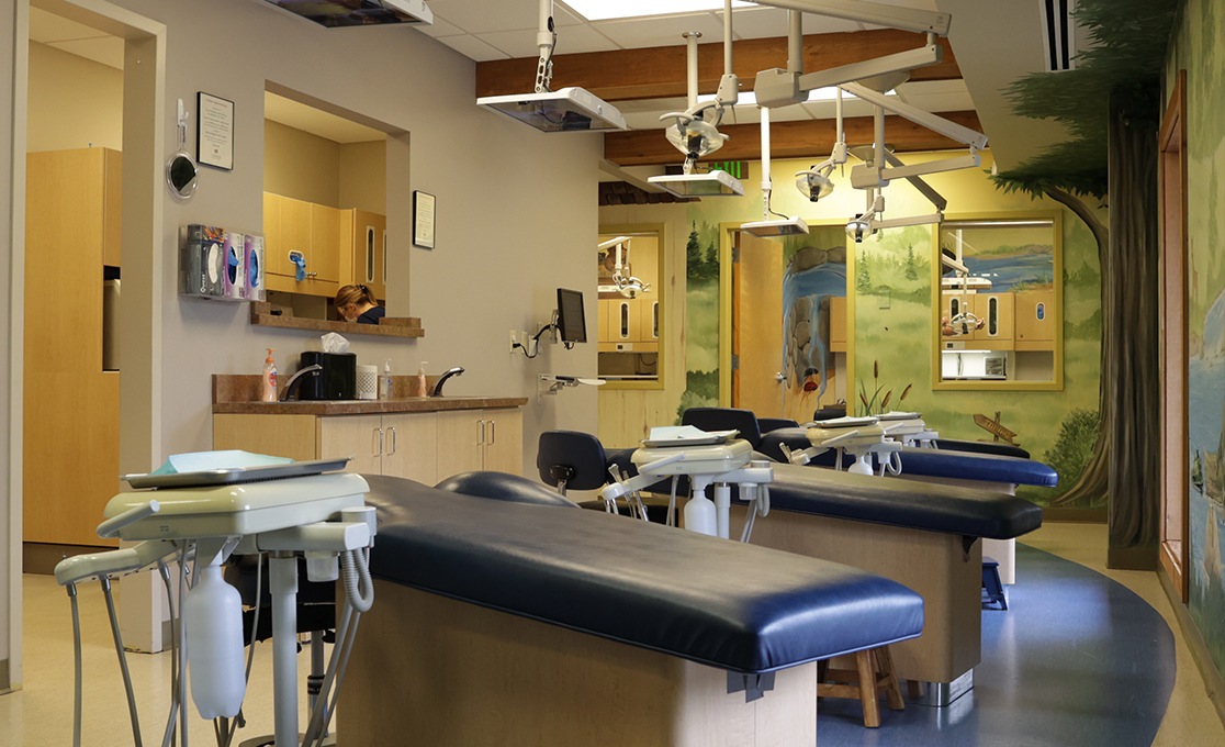 Row of children's dentistry treatment chairs